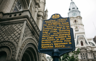 Closeup of historical plaque in front of Masonic Temple