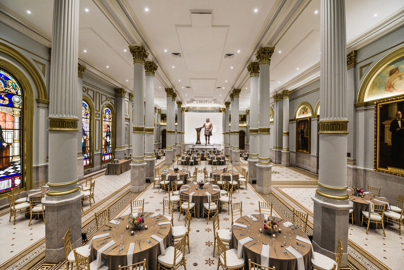 Wide shot of grand ballroom with set tables