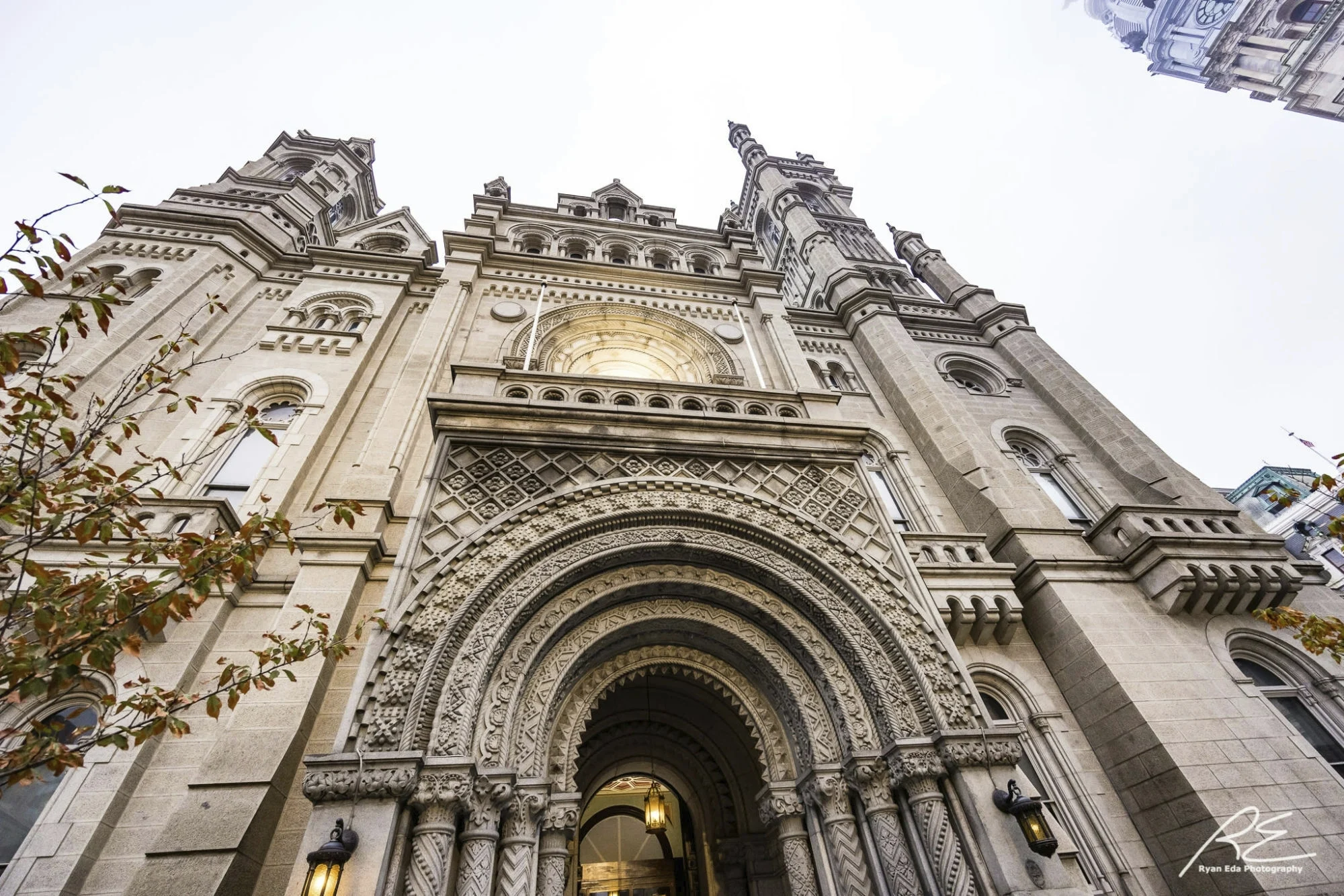 Angled photo of the Masonic Temple, Library and Museum exterior featuring elaborate entryway and balcony