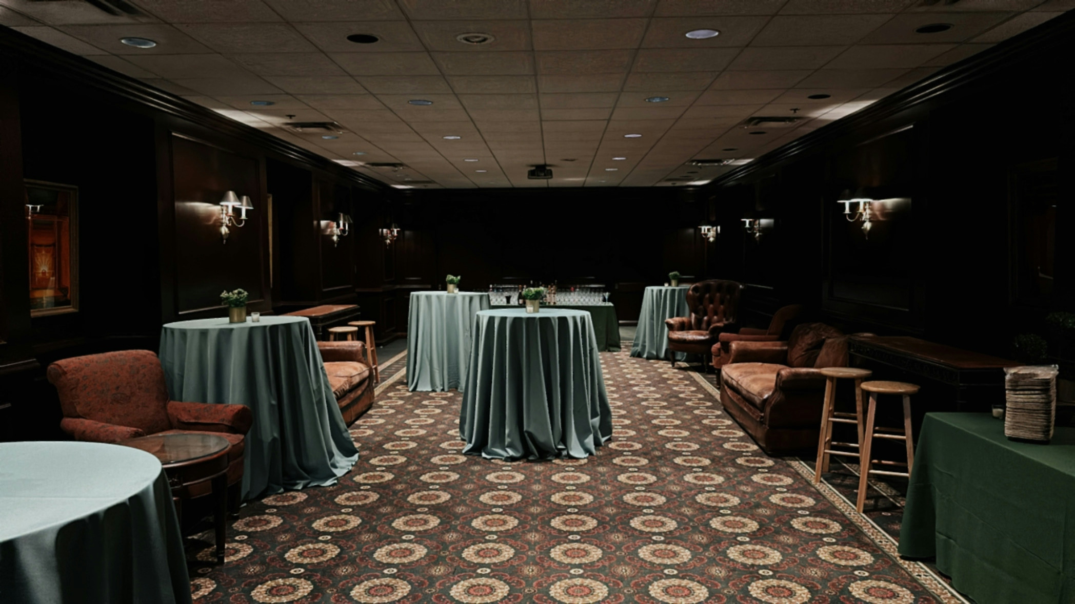 Room with tables decorated with green and brown accents