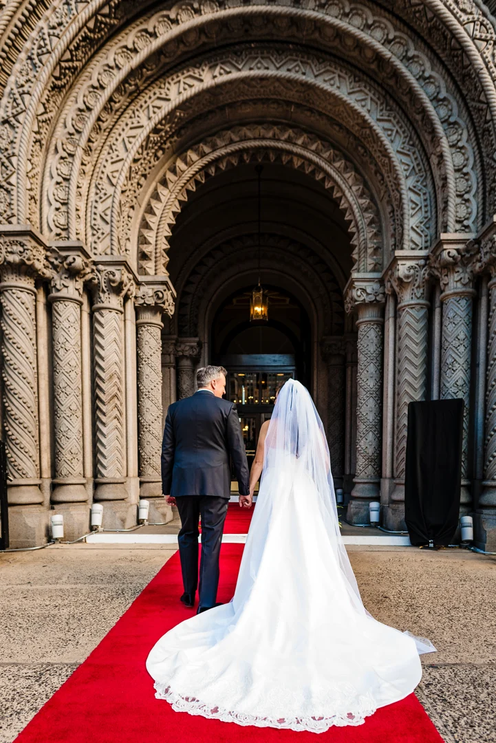 next-level-photo-2 Bride walking with groom on red carpet