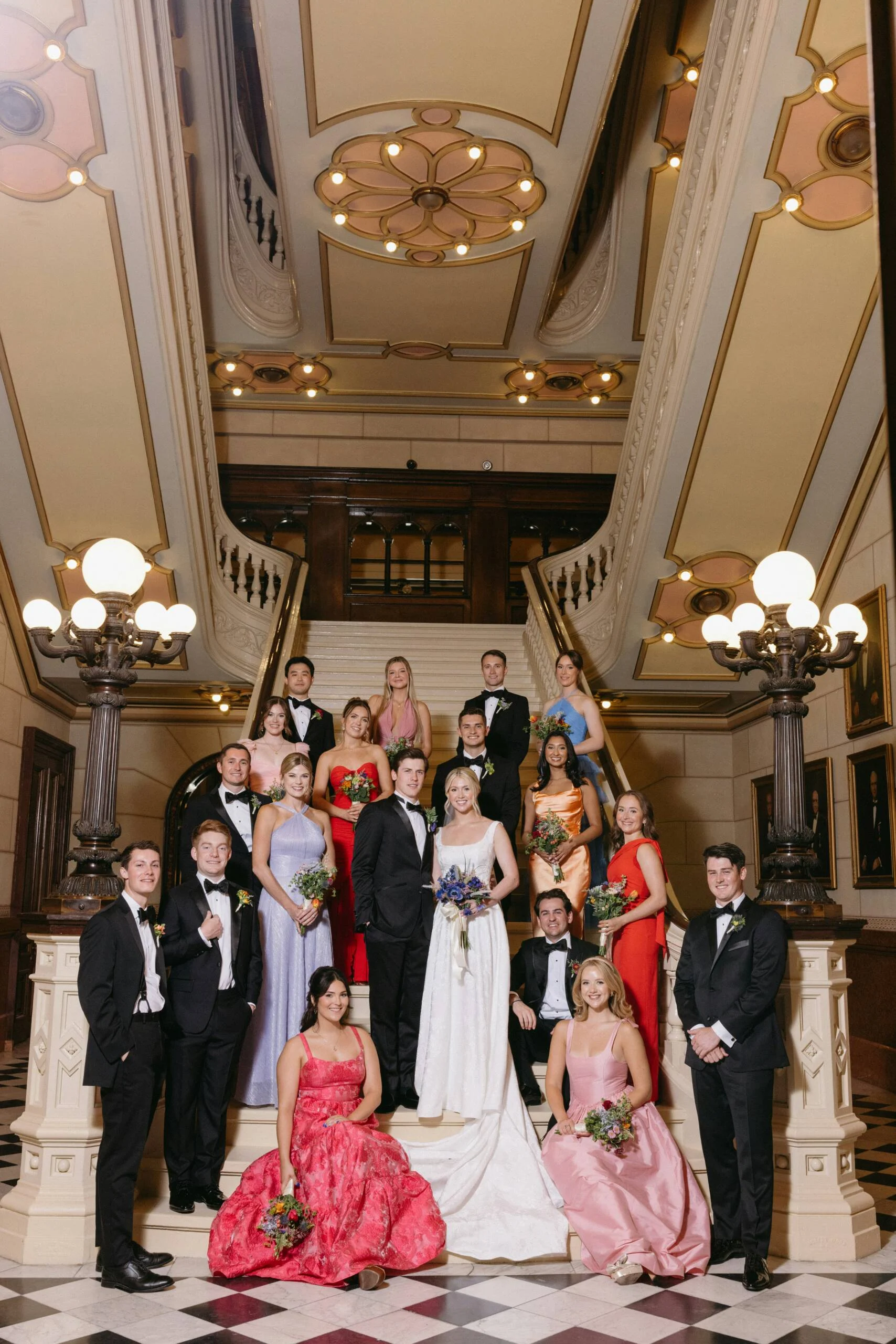 unexpectedreds2-scaled Bridal party with couple dressed in pink and red highlights