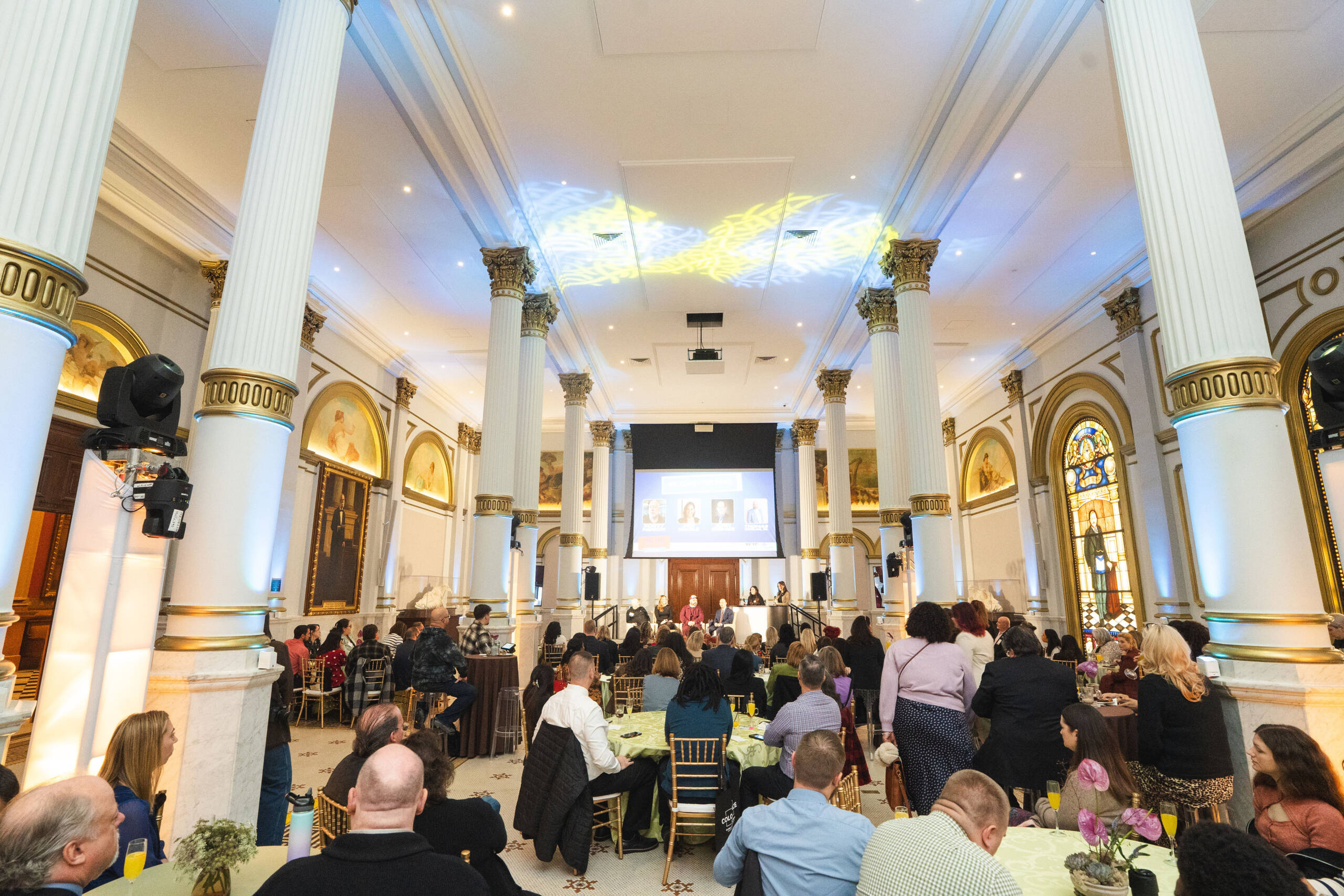 Large hall with custom decorative lighting projected on the ceiling.